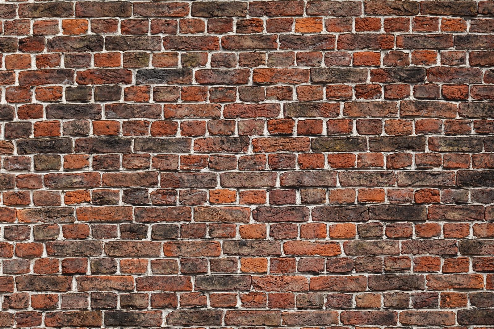 A flat red-brick wall filling the frame