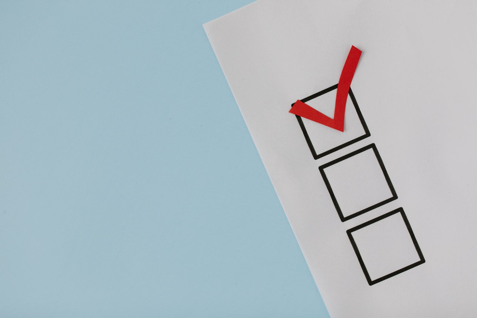 A red tick marked in the first of a column of empty checkboxes